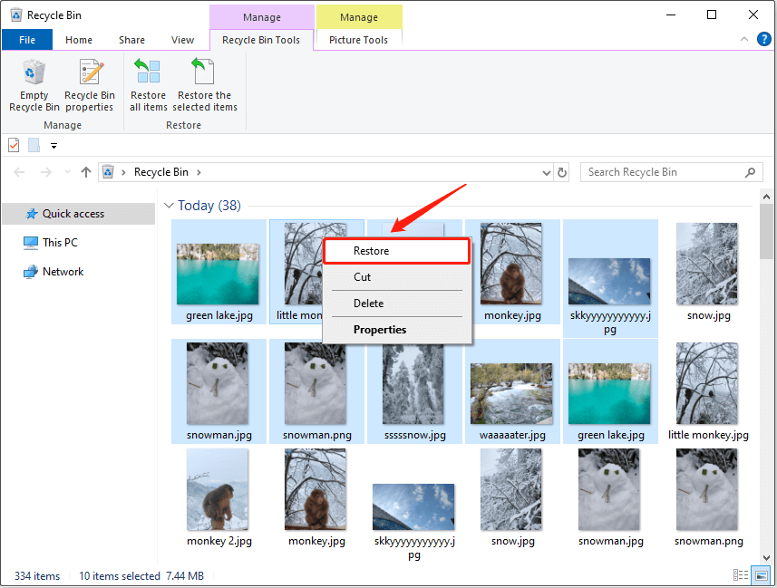 several pictures are selected to be restored from the Recycle Bin