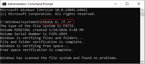 The Command Prompt window showing the process of the CHKDSK command running.