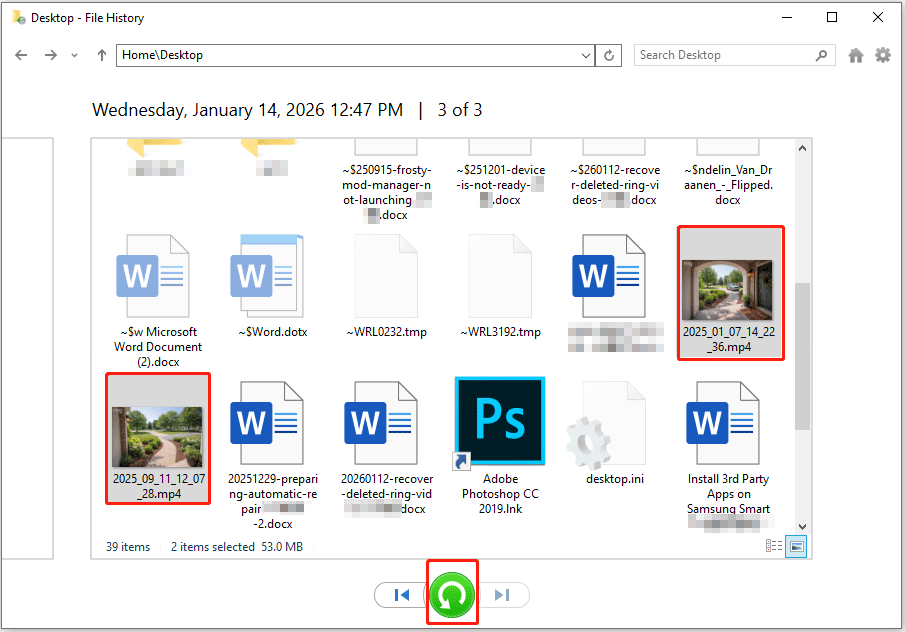 File History interface showing the backup files, with two video files selected and the Restore button highlighted.