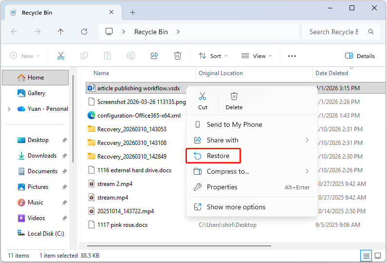 The Recycle Bin interface showing deleted files, with the Restore button highlighted.