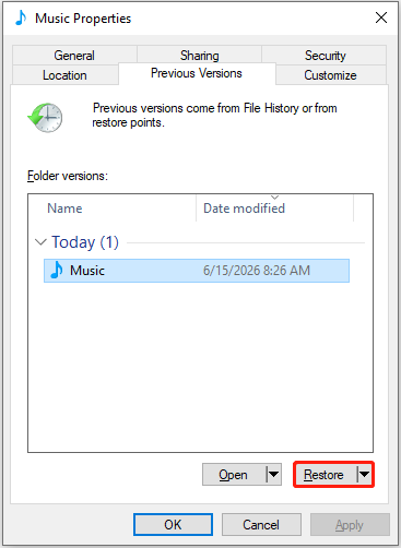 The previous versions of the Music folder, with the Restore button highlighted.